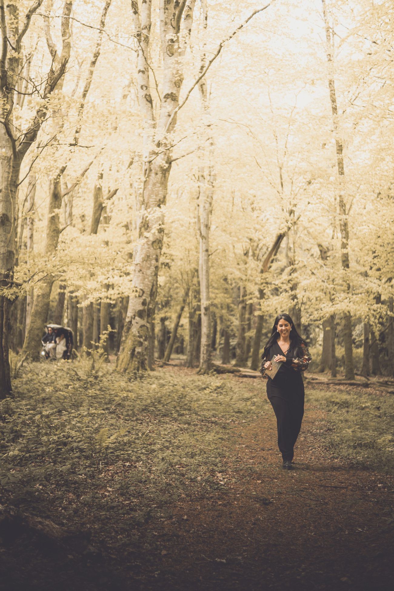 Kamila walking through the forest